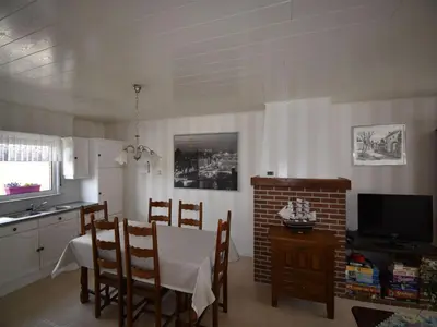a kitchen and dining room with a table and chairs at Elegant & Peaceful Holiday Retreat in Peer in Peer