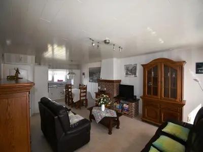 a living room with a couch and a table at Elegant & Peaceful Holiday Retreat in Peer in Peer
