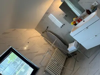 an overhead view of a kitchen with a refrigerator at Nummer 151 villastudios in Hasselt