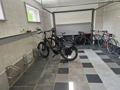a group of bikes parked in a garage at B&B De Kroonhoeve in Beringen