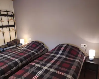 a bedroom with a bed and two lamps on tables at Wonderwall in Houthalen-Helchteren