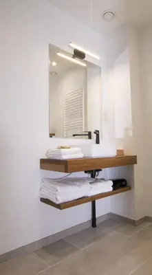 a bathroom with a sink and a mirror at 't pure genot in Dilsen-Stokkem