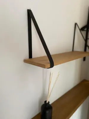 a room with two wooden shelves on a wall at 't pure genot in Dilsen-Stokkem