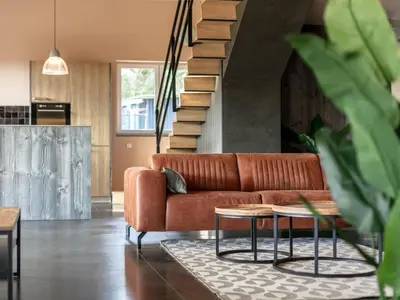 a living room with a couch and a table at Ons Huis in Hechtel-Eksel