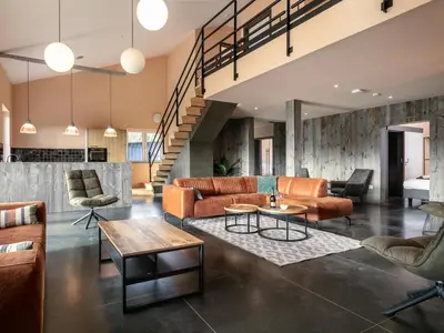 an open living room with couches and tables at Ons Huis in Hechtel-Eksel