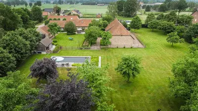 an aerial view of a house with a large yard at 1 Bed Villa - Sleeps 2 - Garden - Parking - Wifi in Grote-Brogel