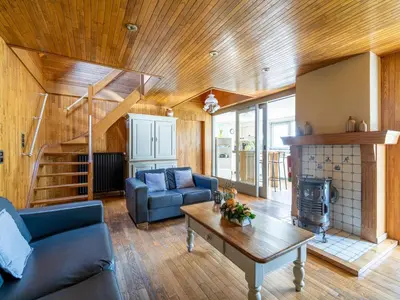 a living room with a couch and a table at De Kievelder in Peer
