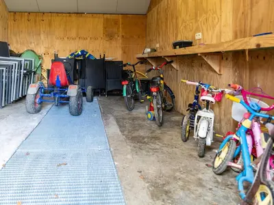 a group of bikes parked in a garage at Het Bruegelhof in Peer