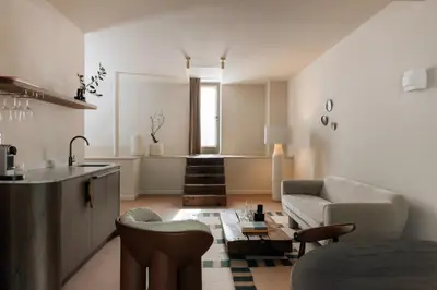 a living room with a couch and a table at Landgoed Altenbroek in Voeren