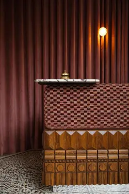 a table in front of a red curtain at Landgoed Altenbroek in Voeren
