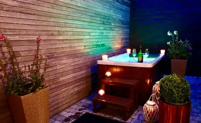a bathroom with a sink and some potted plants at SuiteDreams - Bubble Suite Liège in Liège