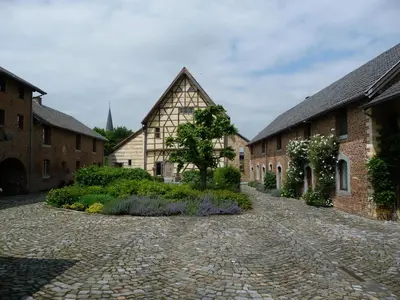 a cobblestone street in front of some buildings at Hof van Eggertingen nr. 8 in Riemst