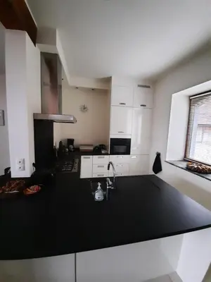 a kitchen with a black counter top and a sink at Hof van Eggertingen nr. 8 in Riemst