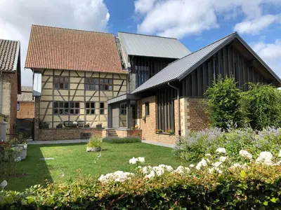 an image of a house with a garden at Hof van Eggertingen Bakhuis in Riemst