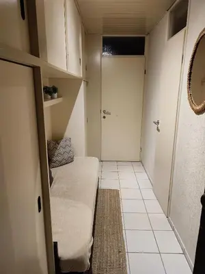 a small room with a bed and a door at Your Stay in Kelmis - La Calamine- Cosy apartment in the Ardennes -Three-country point - Neu-Moresnet in Kelmis