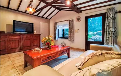 a living room with a couch and a coffee table at Stunning Home In Meeuwen-Gruitrode in Aan ʼt Hoolven