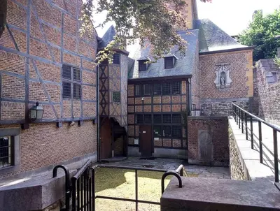 an external view of a building with a gate at La cave de Nana in Liège
