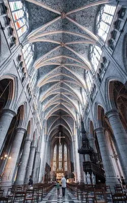 a large church with a large ceiling and chairs at La cave de Nana in Liège