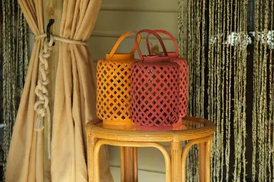 two bags sitting on a table next to a curtain at Chalet Maurice in Zutendaal