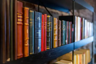 a row of books sitting on a shelf at L'atelier de Liège: Tranquillité & Effervescence in Liège