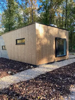 a small wooden house in the middle of a forest at Sweet Valley Julia in Zutendaal