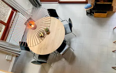 an overhead view of a table with chairs and an umbrella at Sonnevijver Vijverdorp-Waterl in Bovenwezet