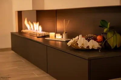 a counter with candles and a bowl of fruit on it at Vakantiewoning Xalot in Tongeren