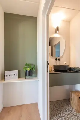 a bathroom with a sink and a mirror at Villa veld en velo in Bree