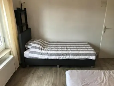 a small bedroom with two beds in a room at 8P 3B Cozy vacation home for 8 persons in Heers in Heers