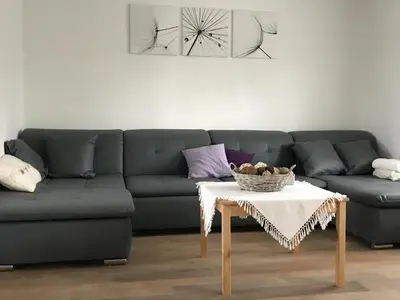 a living room with a couch and a table at 8P 3B Cozy vacation home for 8 persons in Heers in Heers