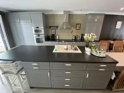 a kitchen with a kitchen island with a sink at 8P 3B Cosy vacation home for 8 persons in Heers