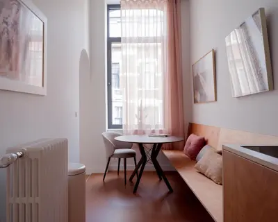 a small room with a table and a window at La Maison de Chestret in Liège