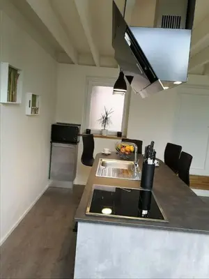 a kitchen with a sink and a counter top at Ô'bel Écrin in Aubel