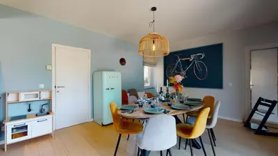 a kitchen and dining room with a table and chairs at SINTPIETER18 @Lo-Ghis vakantiewoning in Voeren