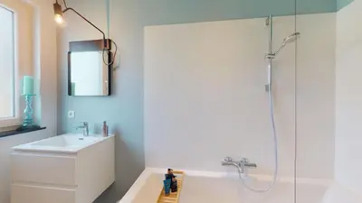 a bathroom with a shower and a sink and a toilet at SINTPIETER18 @Lo-Ghis vakantiewoning in Voeren