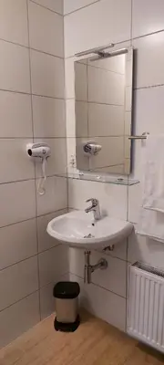 a bathroom with a sink and a mirror at Louis in Maaseik