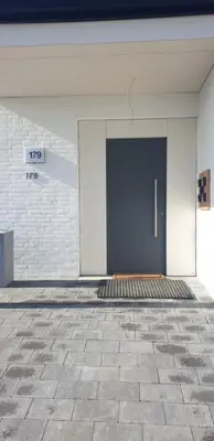 a door on the side of a building at Louis in Maaseik