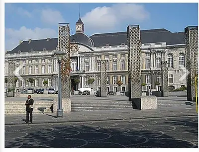 a man standing in front of a large building at La suite de lati in Liège