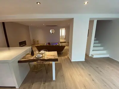a living room with a couch and a table at Casa Honey in Liège