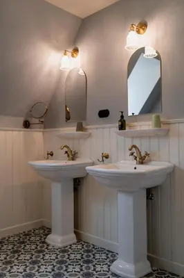 two sinks in a bathroom with two mirrors at Villa les Bruyères in Dilsen-Stokkem