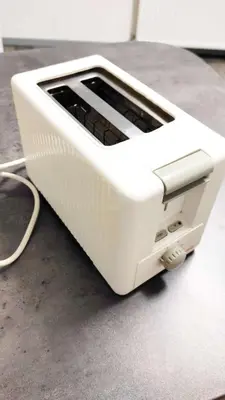 a white toaster sitting on top of a counter at Elena's Apartment in Liège