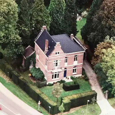 an aerial view of a large house on a lawn at Villa Asch in As