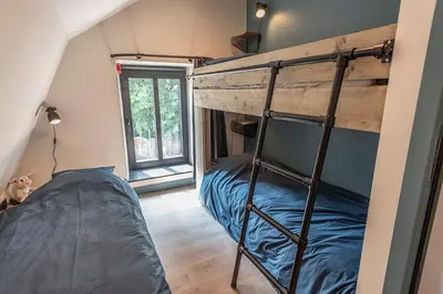 a bedroom with a bunk bed in a room at In't Groene Woud in Peer
