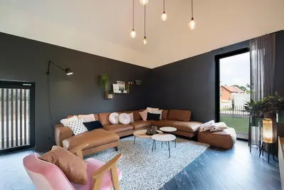 a living room with a couch and a table at In't Groene Woud in Peer