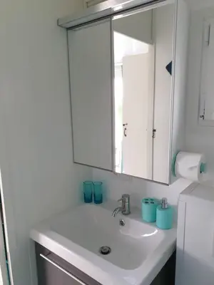 a bathroom with a white sink and a mirror at Tijd voor jezelf en elkaar bij Me&We in Zutendaal
