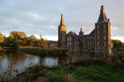 an old castle with a river in front of it at Vakantiewoning P3F in Plombières