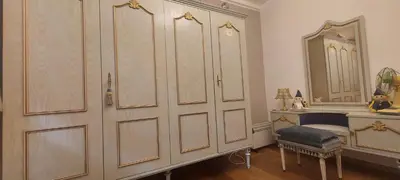 a room with a large wardrobe and a mirror at 'T boshuisje in Oudsbergen