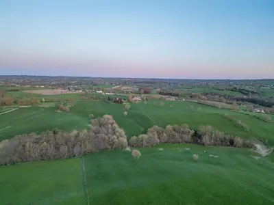 an overhead view of a green field with trees at Ô Macra House - Aubel, Pays de Herve in Aubel