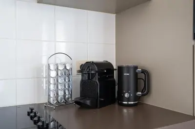 a coffee maker on a counter in a kitchen at Saint Pablo Design Apt I 2BR, Free Parking, Stunning View & Large Terrace in Hasselt