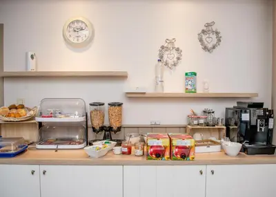 a kitchen with a counter with food on it at B&B De Fruithoeve in Hoeselt